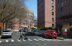 Thwaites Place street view with woman walking Thwaites Place street view with woman walking