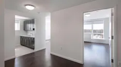 Thwaites Place white interior with dark wood floors and cabinets Thwaites Place white interior with dark wood floors and cabinets