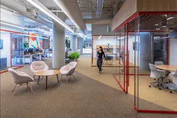 Award winning branding is integrated into the office design through office room trim and carpet patterns. Photo by SLAM Award winning branding is integrated into the office design through office room trim and carpet patterns. Photo by SLAM