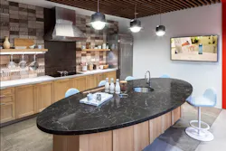 Food and beverage-inspired amenities like the office café bar and tasting room reflects the brand experience. Photo by SLAM Food and beverage-inspired amenities like the office café bar and tasting room reflects the brand experience. Photo by SLAM