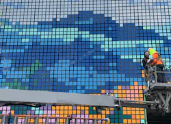 Construction workers building moving tech mural Construction workers building moving tech mural