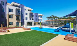 School district multifamily housing exterior with playground School district multifamily housing exterior with playground