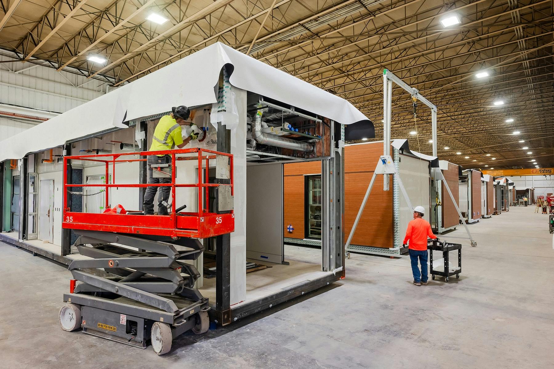 Volumetric structural modules under construction at Bildt&rsquo;s fabrication facility in Oshkosh, Wis. The modules comprise a permanent in-patient expansion for a hospital in Minnesota.