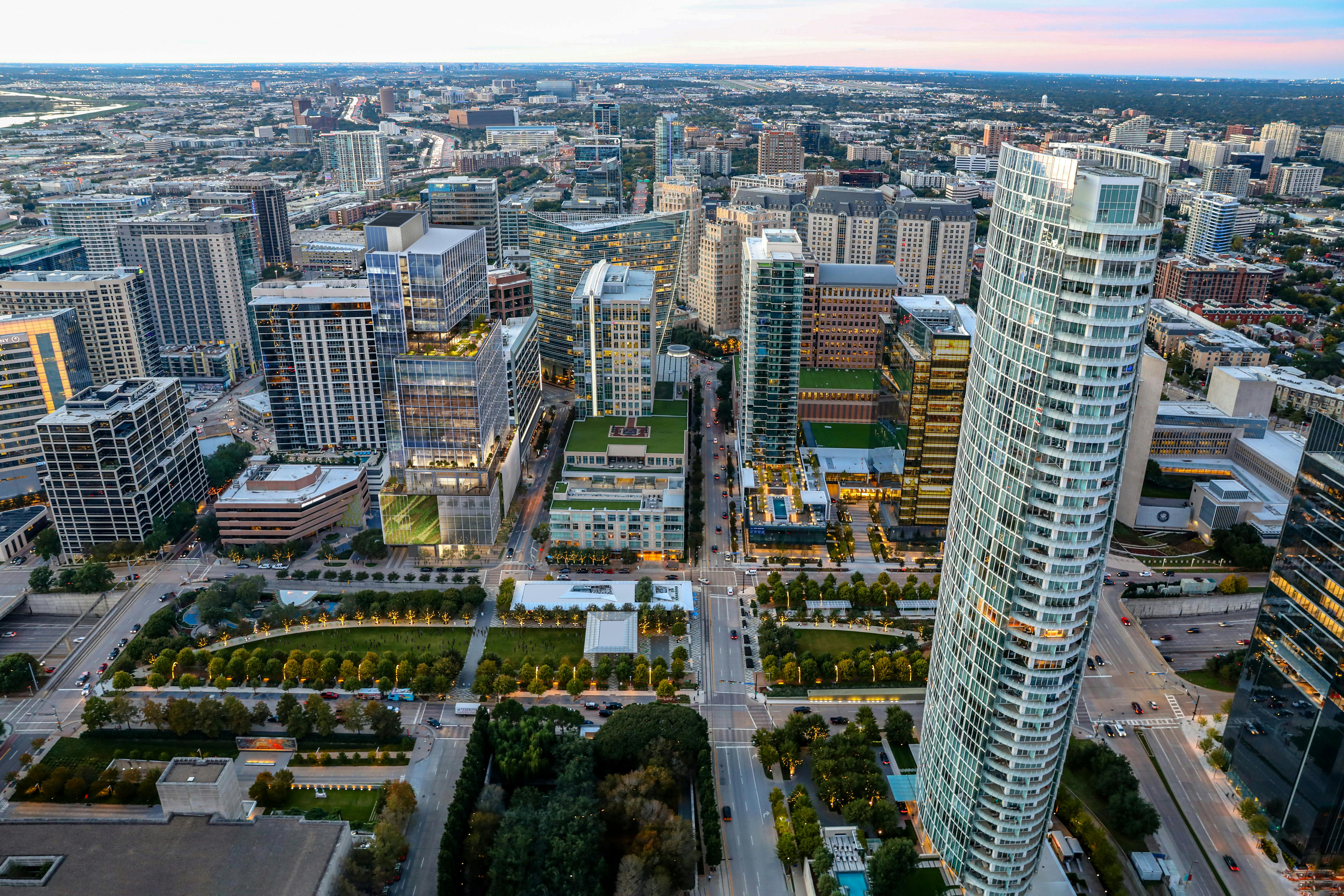 Pictured: Bank of America Tower at Parkside, Dallas, Texas. The Bank of America Tower at Parkside&rsquo;s 30 stories feature a striking sculptural design, where transparent glass and landscaped terraces blend seamlessly with the park below, creating a visually dynamic experience