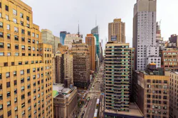 Beautiful landscape view of New York City skyline with high-rise buildings and busy street seen from above. New York. USA. Beautiful landscape view of New York City skyline with high-rise buildings and busy street seen from above. New York. USA.