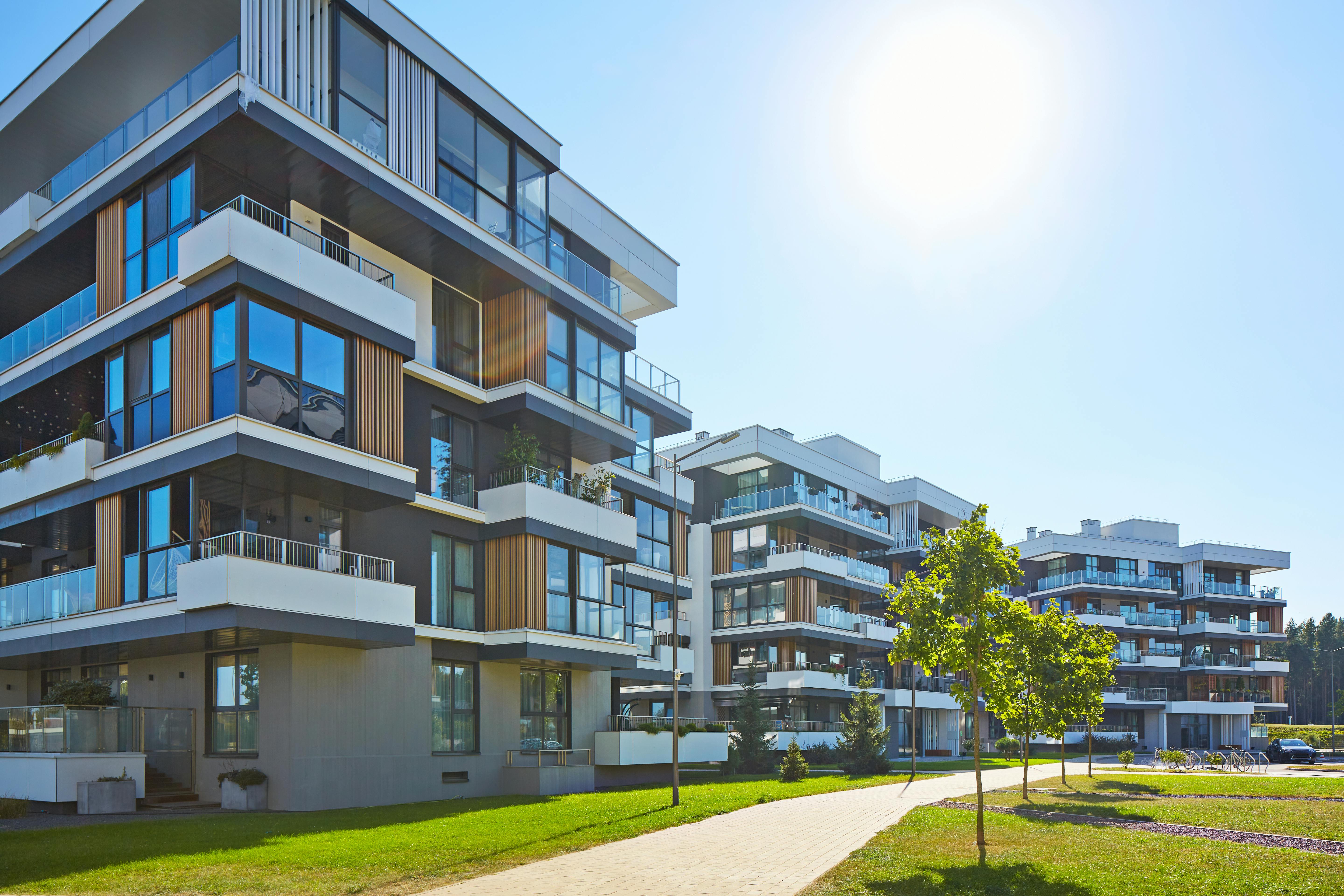 New modern block of flats in green area. residential apartment with flat buildings exterior. luxury house complex. Part of City Real estate property, condo architecture. apartment insurance concept