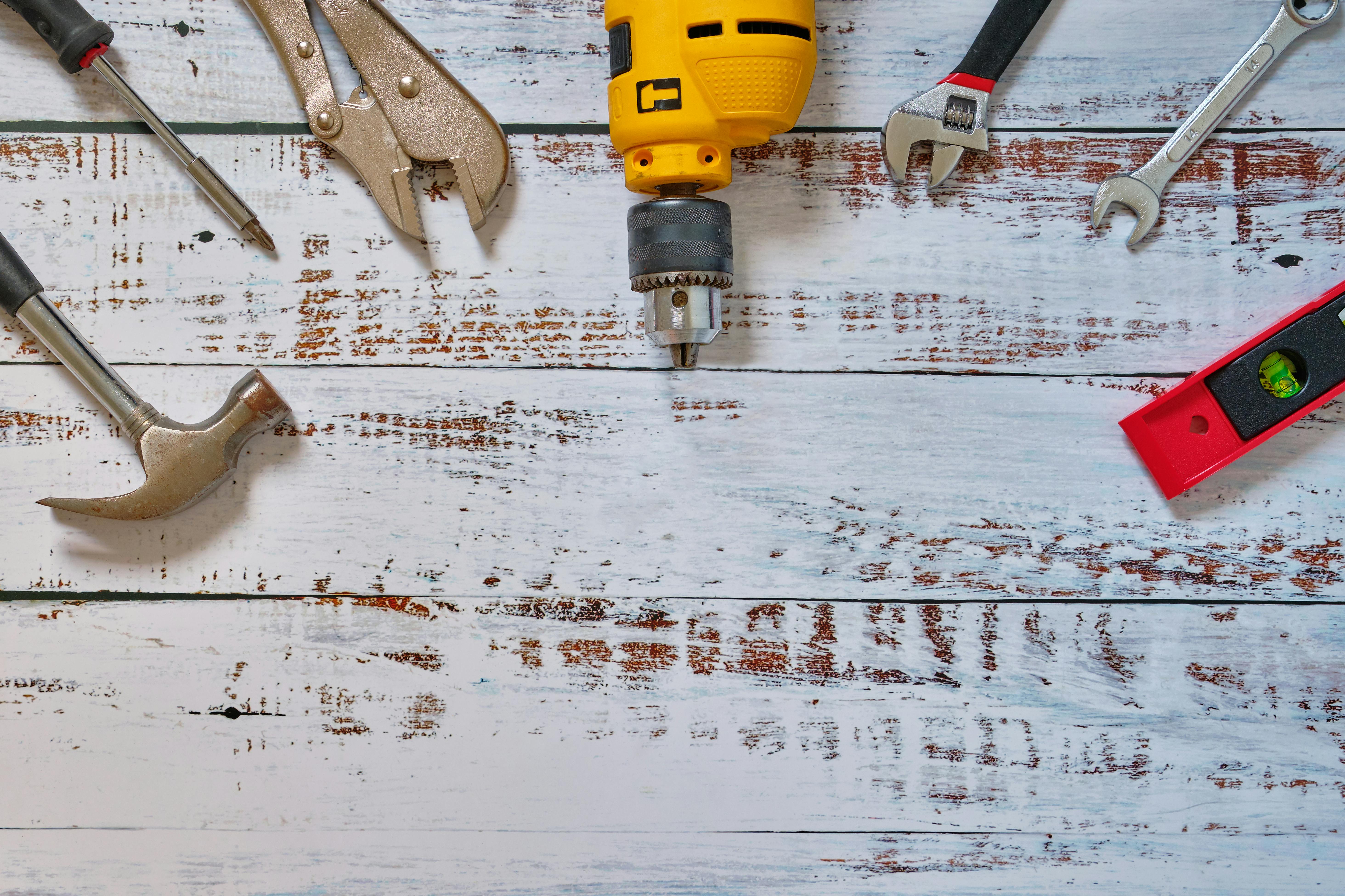 Faltlay ,Construction concept set of tools supplies for home construction builder or repair tools top view on wooden white background