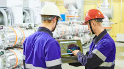 Industrial workers with tablet computer at power energy supply factory Industrial workers with tablet computer at power energy supply factory