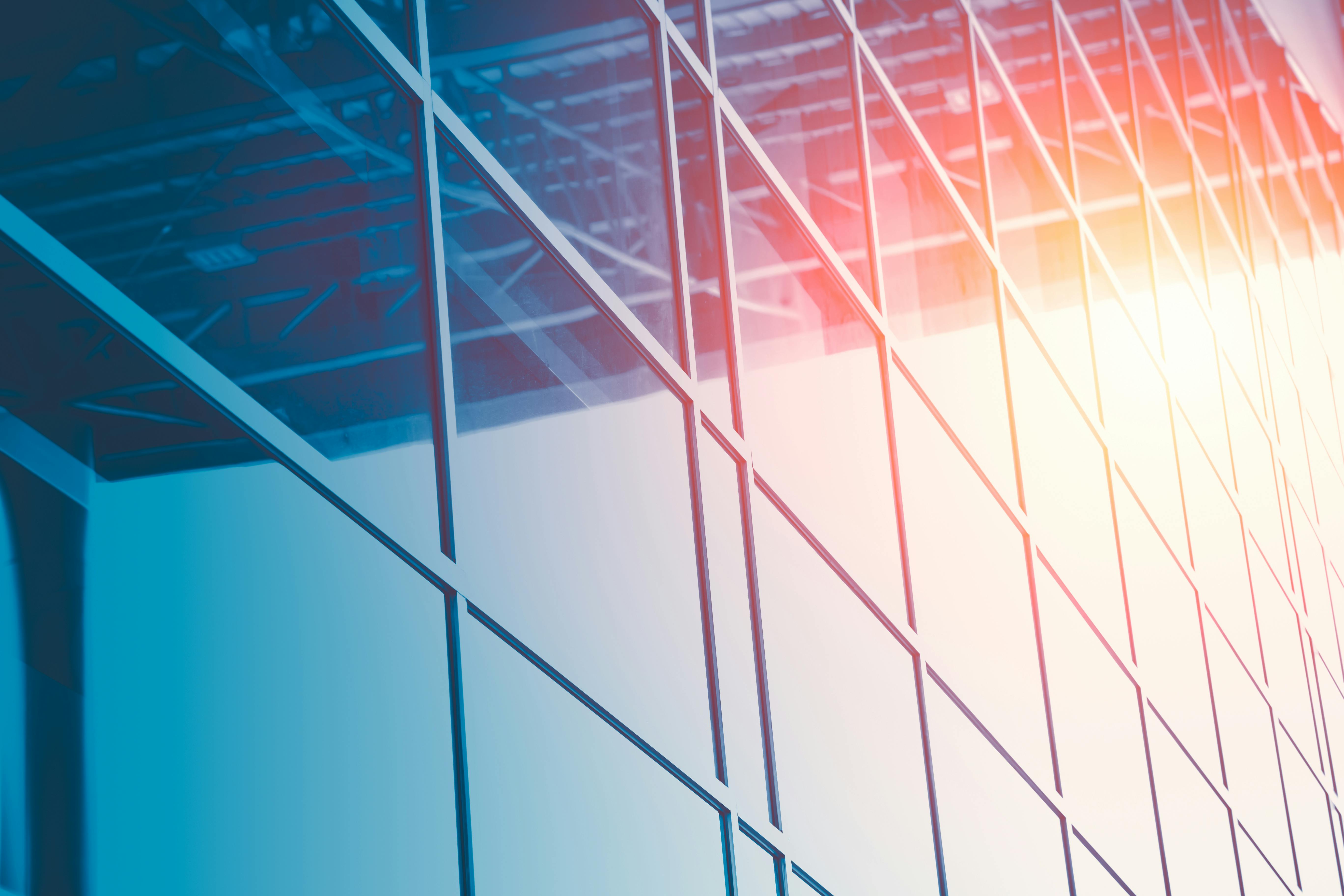 Business Office Glass Windows Building with Sun Reflect for Modern Construction Background