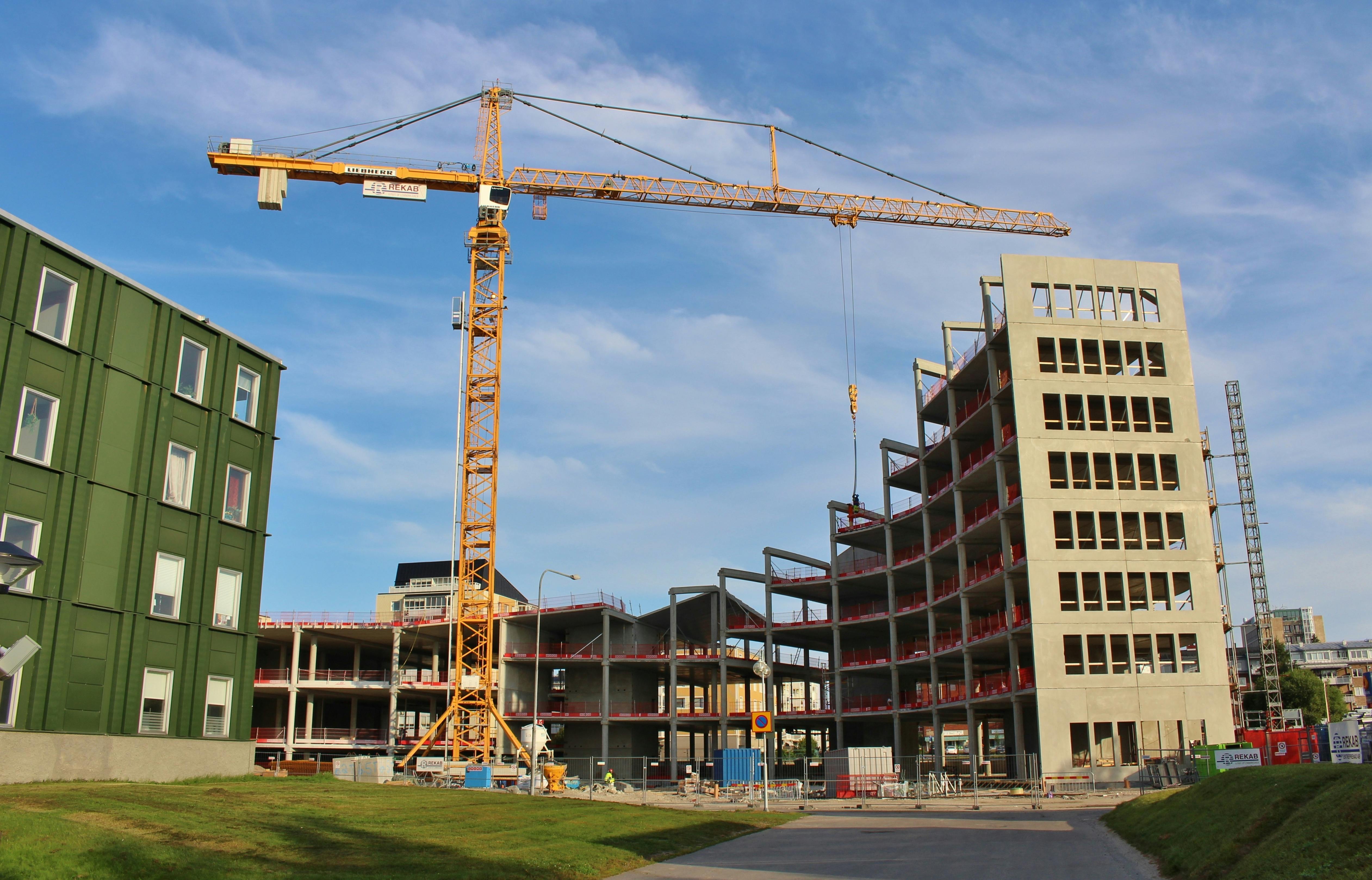 Construction site. A construction crane in the work to construct a new building.