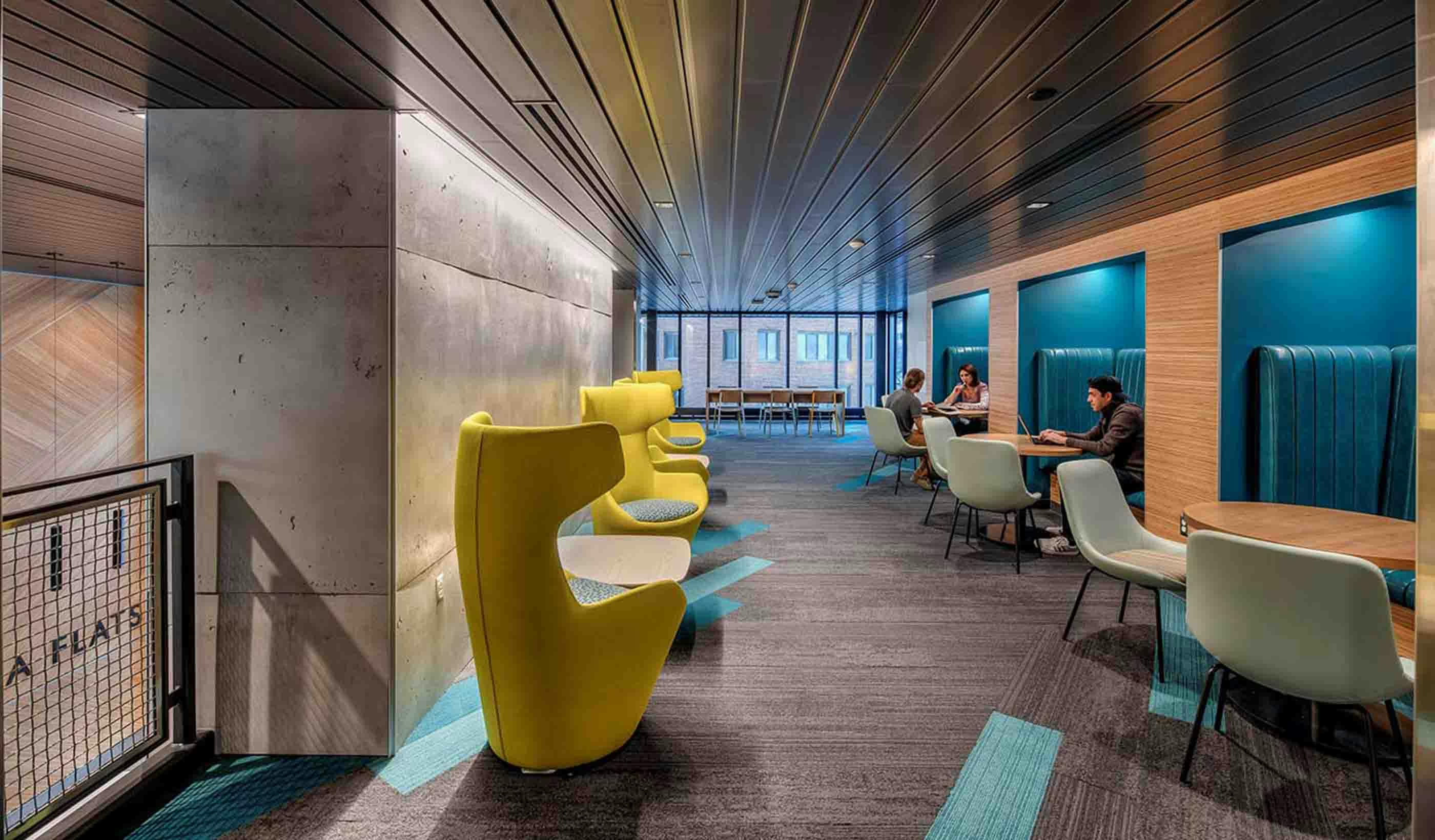 The Arcadia Flats study lounge at Western Michigan University features study pods with an abundance of outlets and bright design colors
