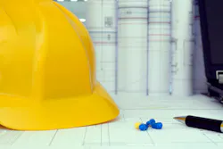 Construction project management tools - helmet, drawings and planning Construction project management tools - helmet, drawings and planning