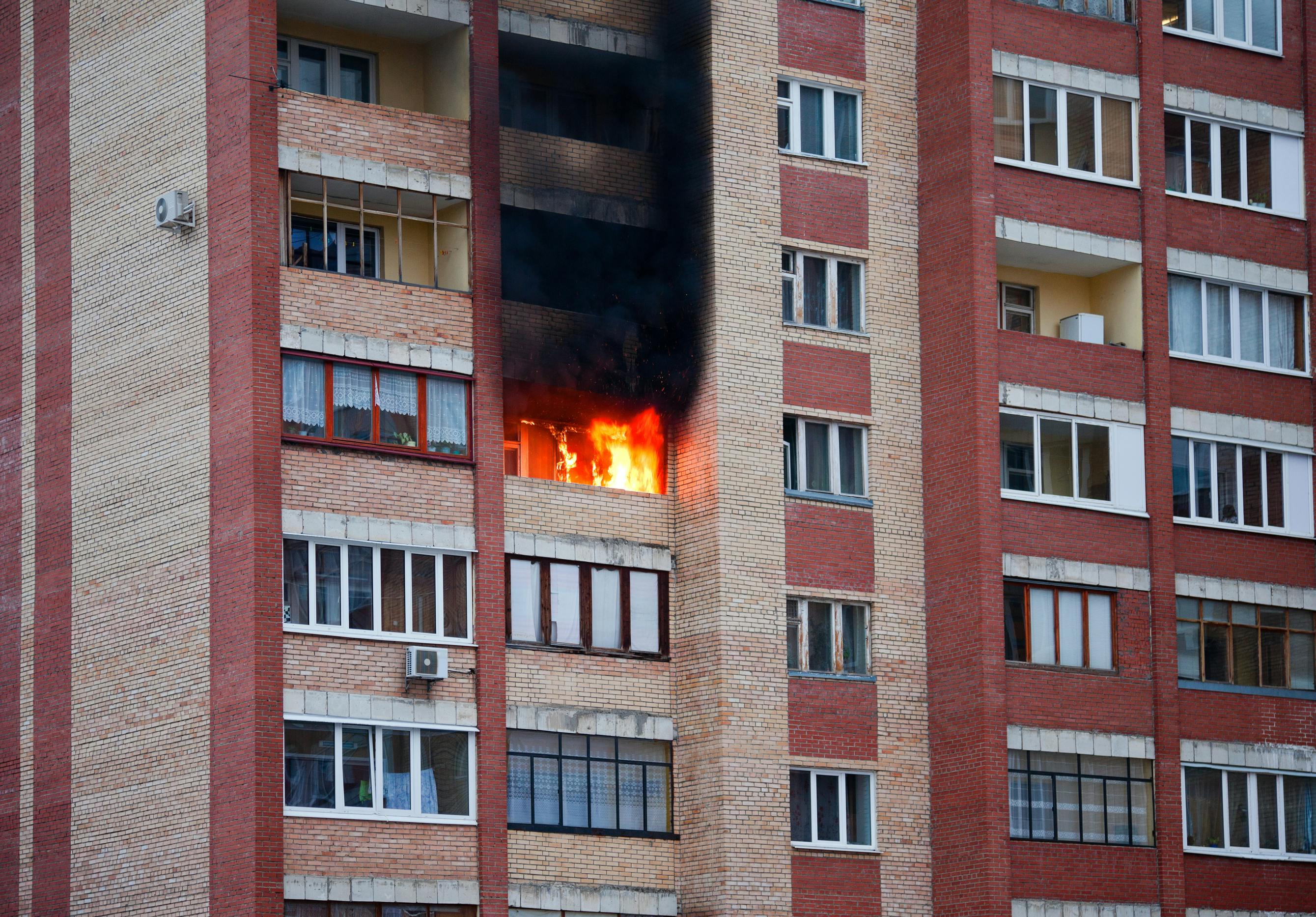 Fire in the multifamily house. Fire in one of the apartments of a large tenement-house