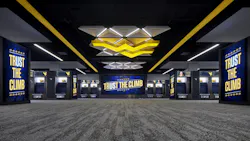 West Virginia University’s football locker room highlights integrated audio and lights within the space West Virginia University’s football locker room highlights integrated audio and lights within the space