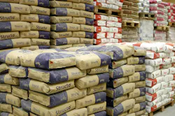 Cement department in construction materials store. Stacks of cement bags and construction materials are displayed in an Do-it-yourself (DOY) hardware store Cement department in construction materials store. Stacks of cement bags and construction materials are displayed in an Do-it-yourself (DOY) hardware store