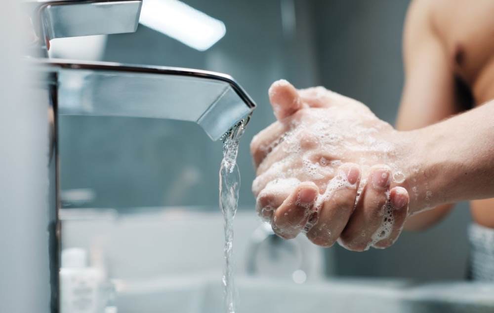 1652318450015 Manwashinghandsbathroom
