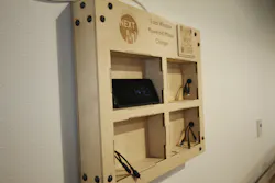 This wooden charging station features a QR code that people can scan to see a customized landing page that tracks metrics about the energy generated by the windows. This wooden charging station features a QR code that people can scan to see a customized landing page that tracks metrics about the energy generated by the windows.