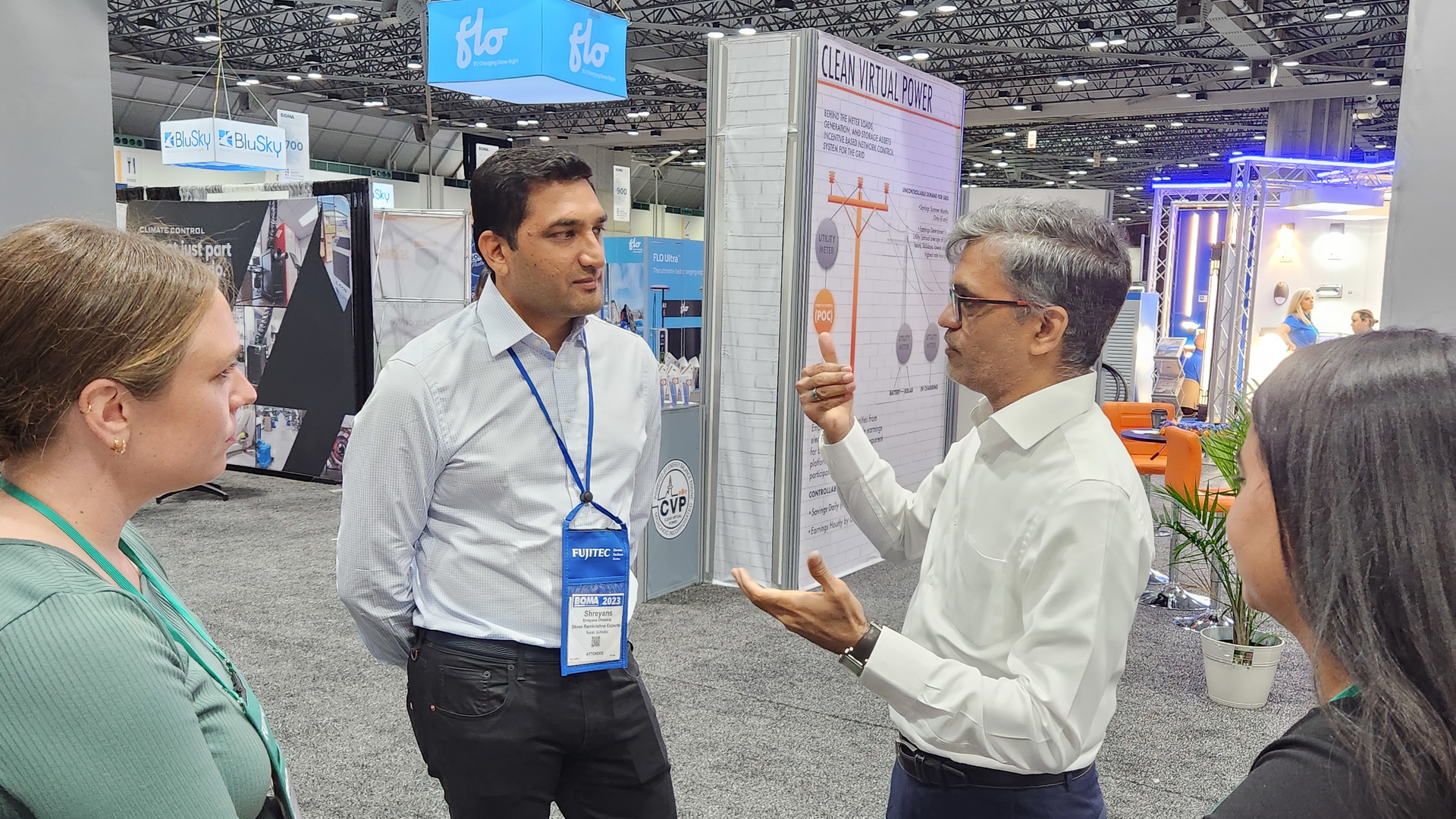 Mahesh Ramanujam, CEO of the Global Network for Zero, discusses the organization on the expo floor at the 2023 BOMA International Conference & Expo. Ramanujam is the former CEO of the U.S. Green Building Council.