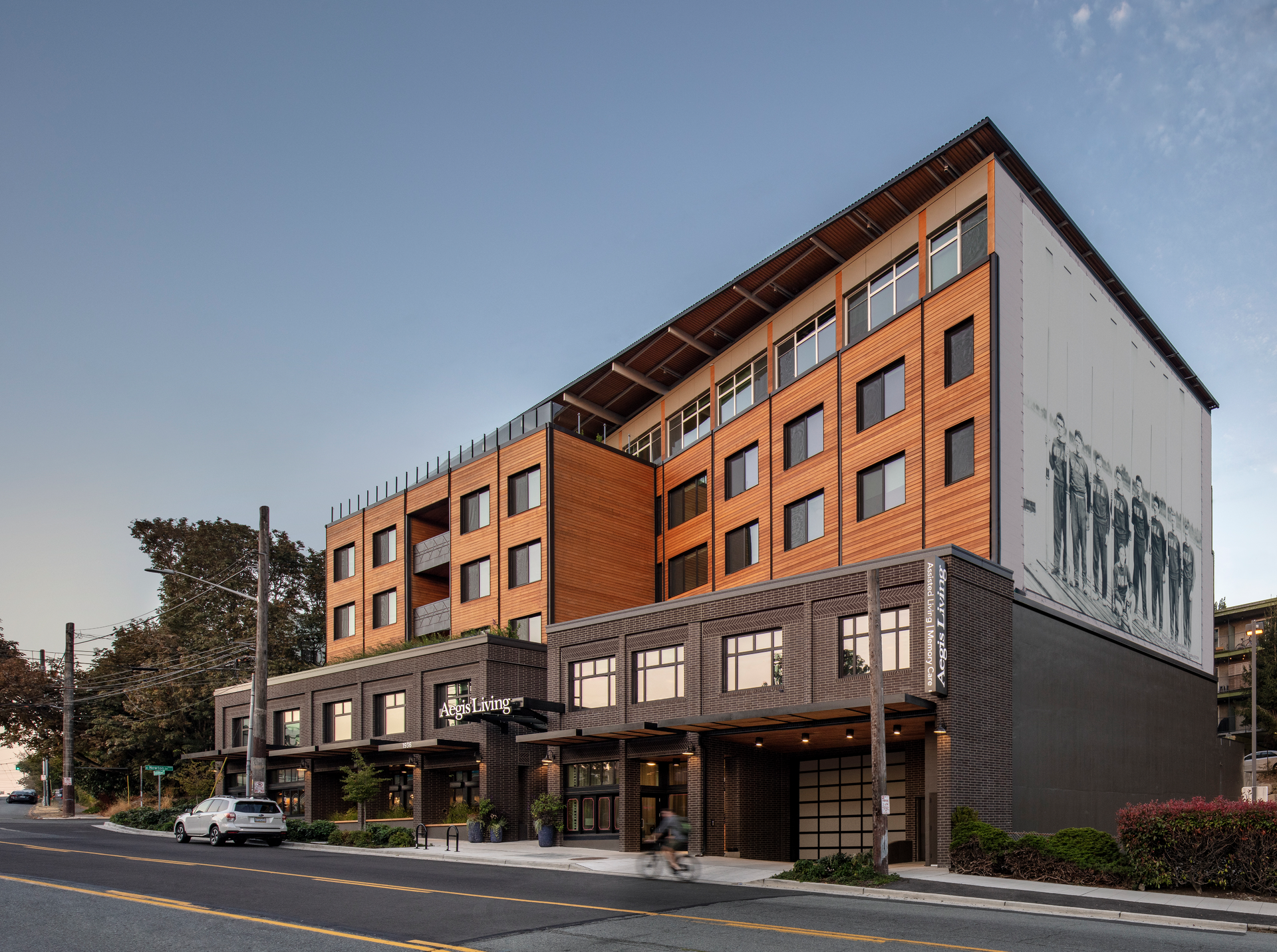 Aegis Living is a 73,000-square-foot assisted living community in Seattle, Washington. The electrified building features the rowing history of the area through imagery and integrated designs.
