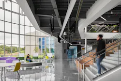 The two-story rotunda offers a variety of seating options, including the stairs, and collaboration spaces at the Francis Tuttle Danforth Campus. Clerestory windows and ambient lighting illuminate the space so users can engage in their educational studies. The two-story rotunda offers a variety of seating options, including the stairs, and collaboration spaces at the Francis Tuttle Danforth Campus. Clerestory windows and ambient lighting illuminate the space so users can engage in their educational studies.