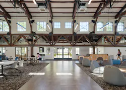 Eastern (main) entrance. Larger glazed doors and replacement of patterned translucent glass with low-E treated clear glass in original steel window frames brightens the space. Eastern (main) entrance. Larger glazed doors and replacement of patterned translucent glass with low-E treated clear glass in original steel window frames brightens the space.