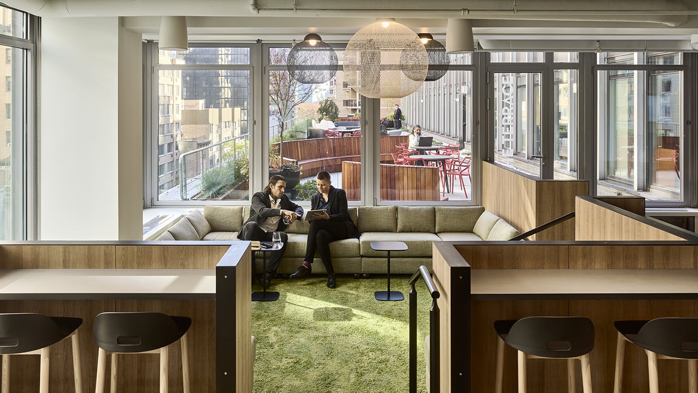 A variety of seating areas, such as this one at EisnerAmper&rsquo;s Manhattan office, are a popular amenity for people who want to work in different ways throughout the day. Consider offering spaces like this for different tenants to book.