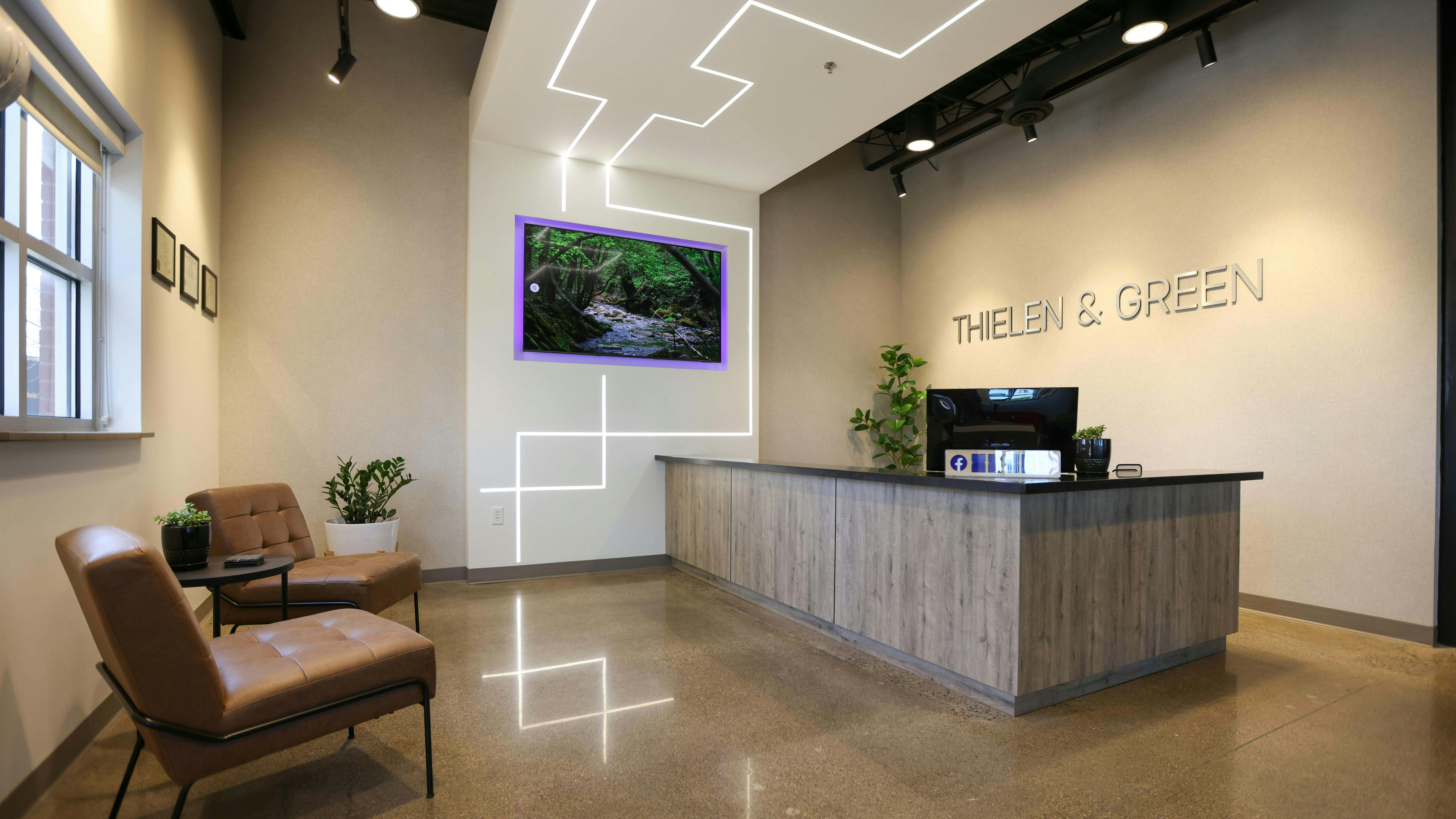 To achieve the immediate wow factor that Thielen & Green desired for guests walking into the new space, a reception lobby area and conference room were targeted to implement a lighting design that visually treats those spaces as one. PureEdge Lighting&rsquo;s TruLine 1A lighting system delivered seamless recessed lines of light that intersect and create patterns.