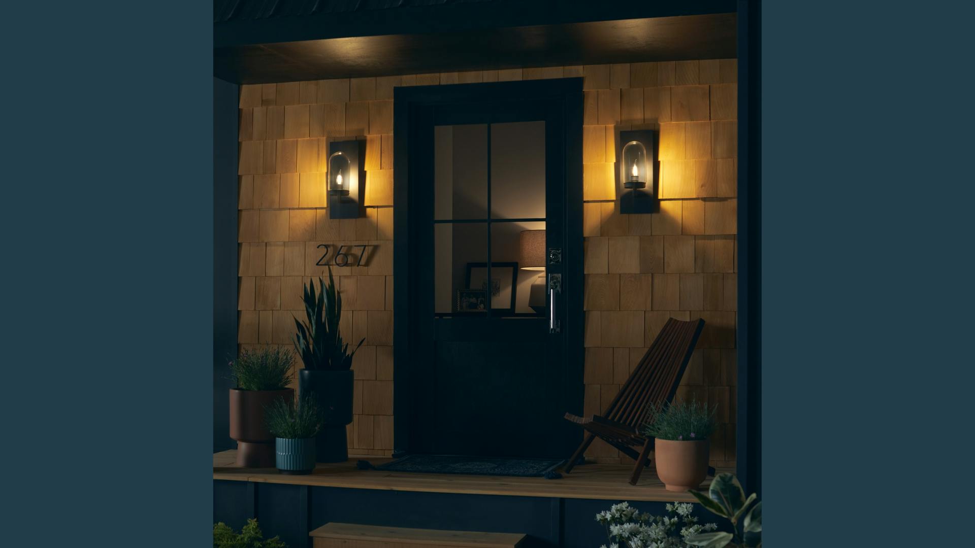 A couple of wirelessly-controllable decorative GE LED lamps warm the exterior of this home setting. (Photo credit: Image courtesy of GE Lighting/Dan Turk/Max Borges Agency.)