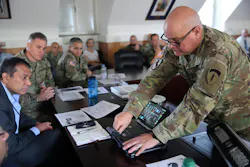 US Army Chief Warrant Officer Andrew Foreman demonstrates Getac hardware working with the Kitefin Li-Fi system at Wiesbaden Army Garrison last August. (Photo credit: Image courtesy of Candy Knight via pureLiFi.) US Army Chief Warrant Officer Andrew Foreman demonstrates Getac hardware working with the Kitefin Li-Fi system at Wiesbaden Army Garrison last August. (Photo credit: Image courtesy of Candy Knight via pureLiFi.)