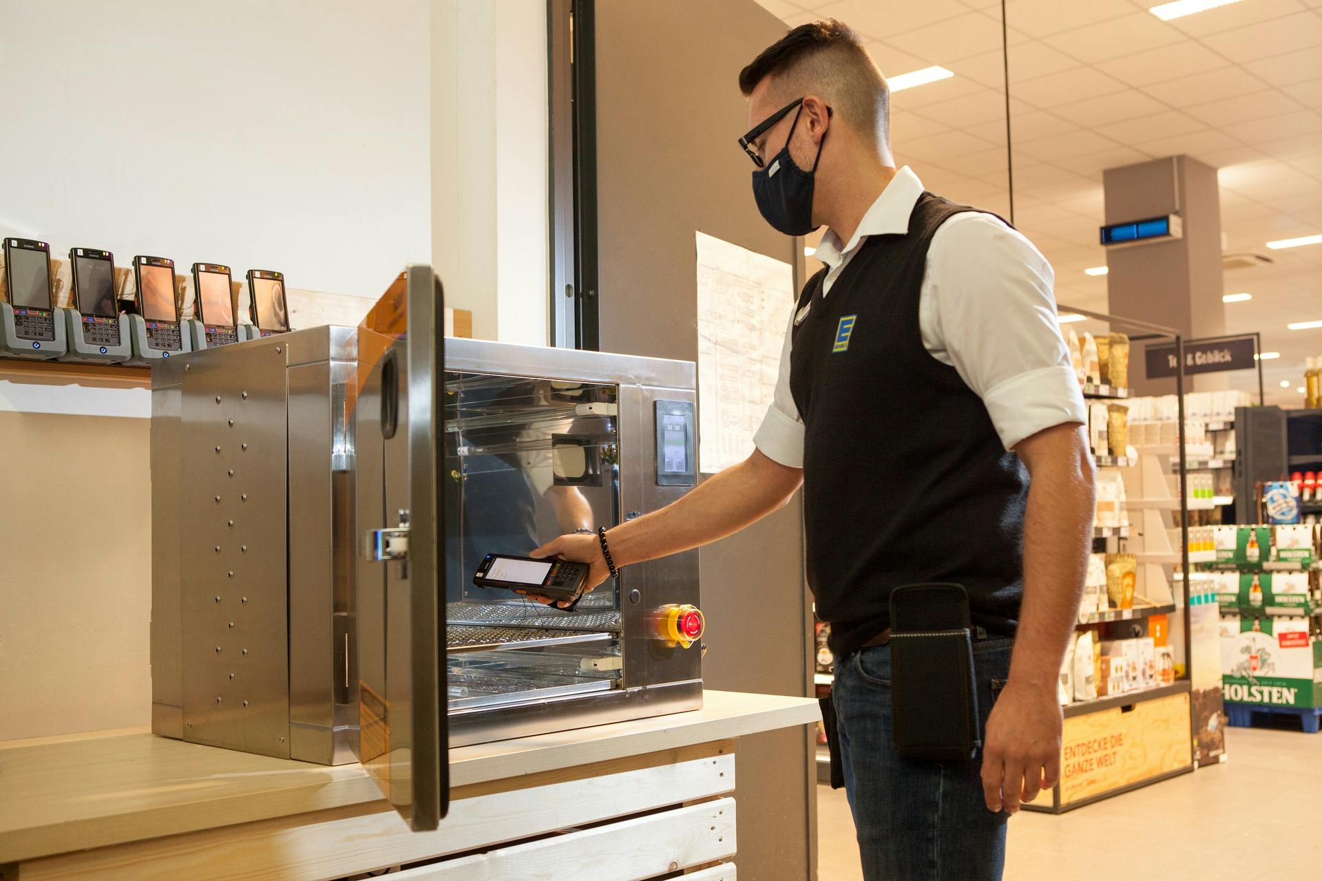 This photo shows a Signify UV-C disinfection chamber for objects, and a Signify wall-mounted, upper-air UV-C device (on the pillar to the right) at an Edeka Clausen store in Hamburg two years ago. But Signify&rsquo;s efforts to fight the SARS-CoV-2 virus in the air, on objects, and on surfaces has not gone to plan.