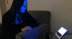 University of Arizona research technician Cami Barnes tests a blue-light device designed to provide circadian entrainment and improve recovery from mild traumatic brain injury (mTBI), as published in a recent study performed by the university’s Department of Psychiatry. (Photo credit: Image by William D. “Scott” Killgore via the University of Arizona press department.) University of Arizona research technician Cami Barnes tests a blue-light device designed to provide circadian entrainment and improve recovery from mild traumatic brain injury (mTBI), as published in a recent study performed by the university’s Department of Psychiatry. (Photo credit: Image by William D. “Scott” Killgore via the University of Arizona press department.)