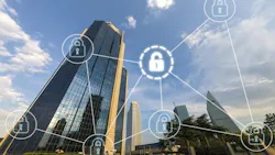 Tall commercial buildings skyline with digital overlay of interconnected pad locks as cybersecurity concept. Tall commercial buildings skyline with digital overlay of interconnected pad locks as cybersecurity concept.
