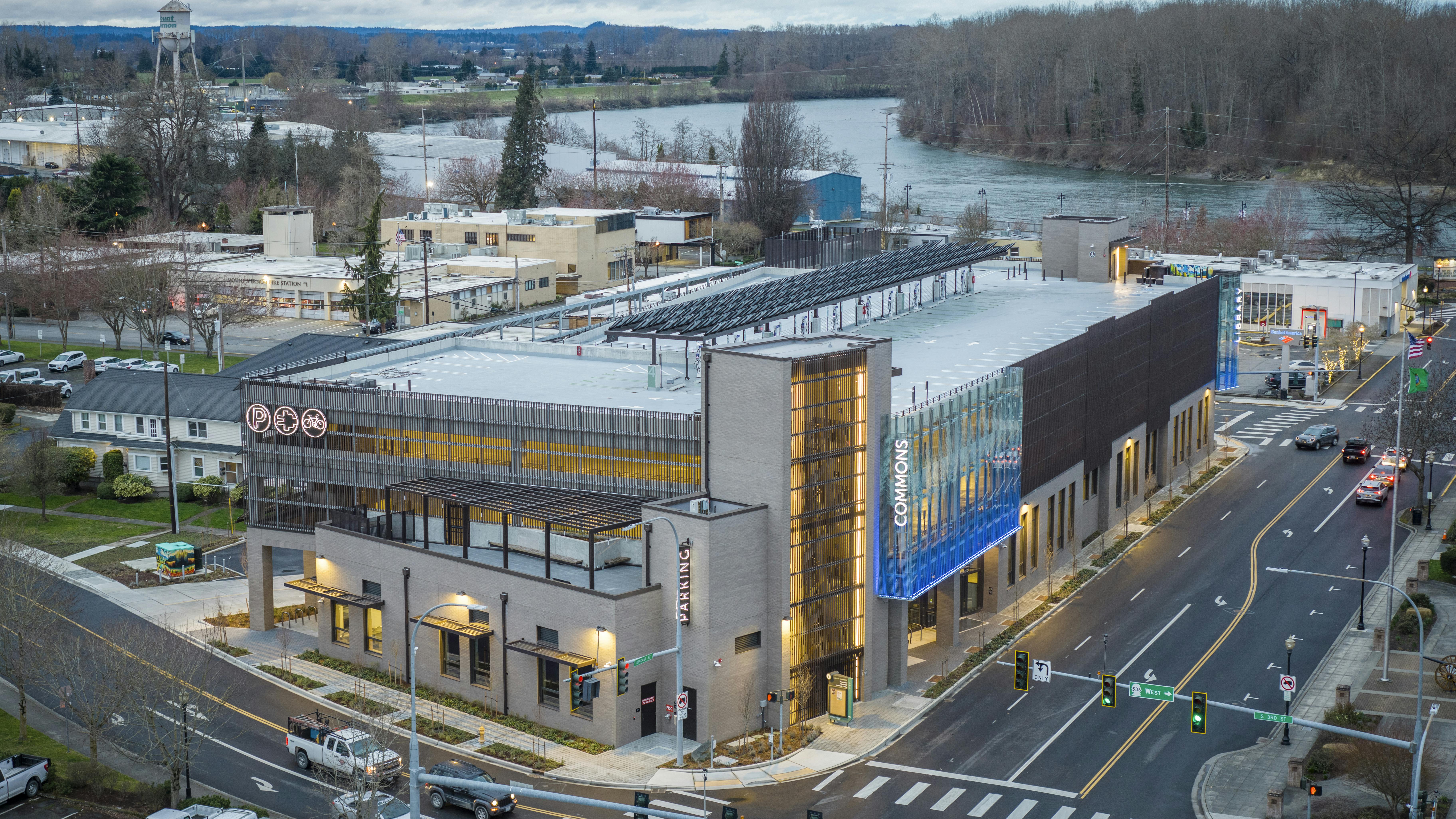 Mount Vernon Library Commons (MVLC) combines three amenities: library, public parking, and community center. One strategy to achieve its EUI of 12 was to keep the garage naturally ventilated with screens.