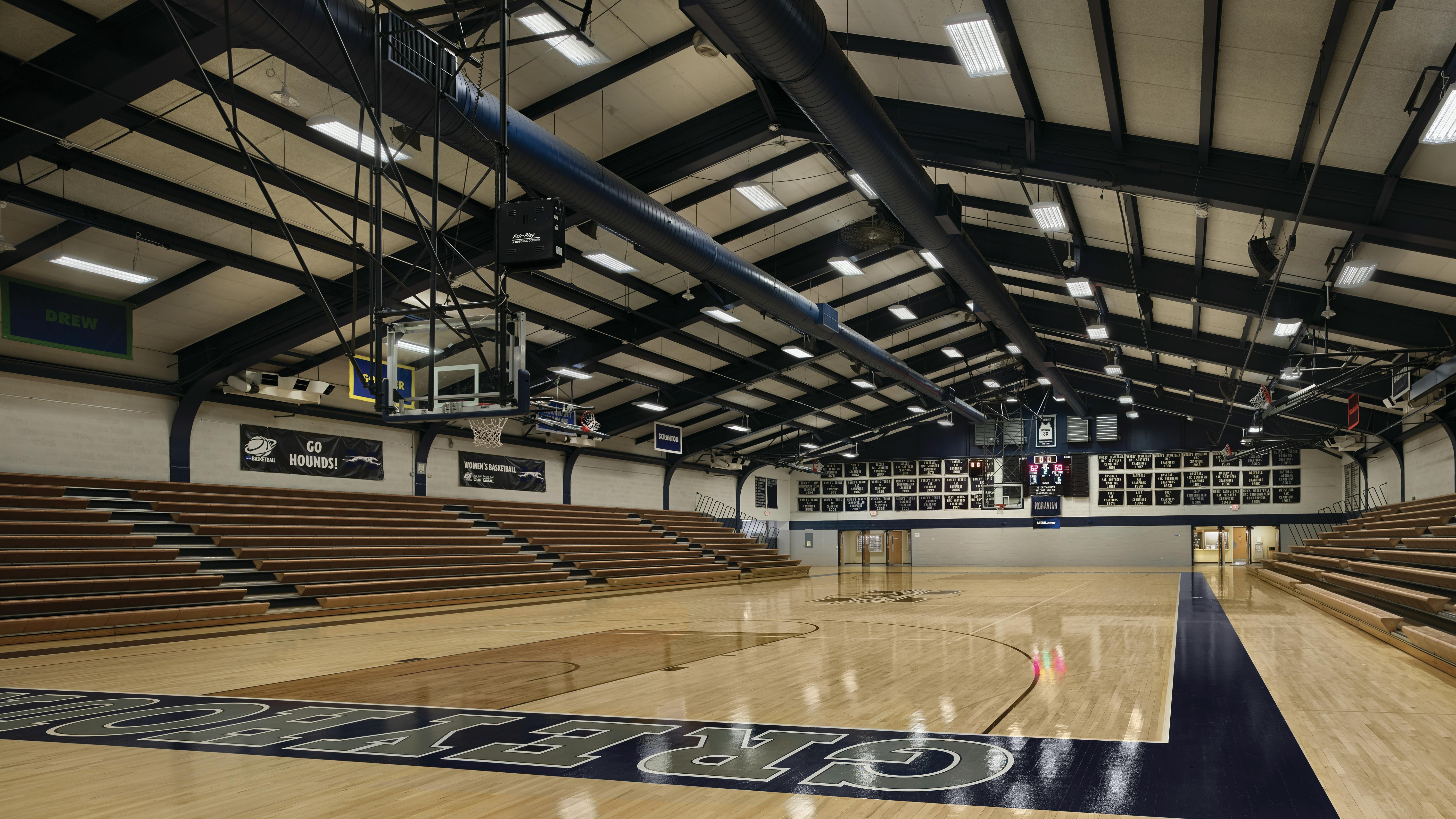 Moravian University in Pennsylvania pursued a fluorescent-to-LED retrofit strategy to obtain energy savings without having to replace fixtures. One of the more substantial retrofit projects involved replacing fluorescent ballasts and lamps in the competition and practice gymnasiums with TLED lamps and drivers.