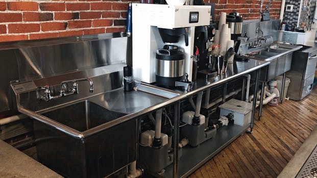 Setting up this caf&eacute; inside a 200-year-old historic building presented challenges&mdash;namely, that the existing plumbing system couldn&rsquo;t easily accommodate a modern commercial kitchen. Drain pumps help manage graywater from several fixtures.
