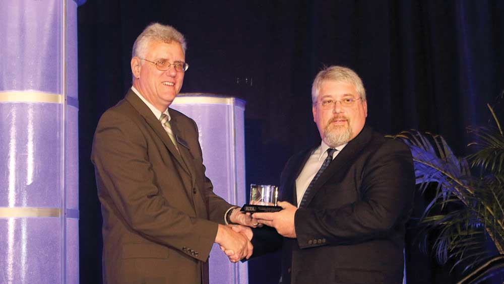 ILTArsquos Vice President of Government Affairs Peter Lidiak presents the 2017 Safety Improvement Award to Brian Temples of TransMontaigne Partners