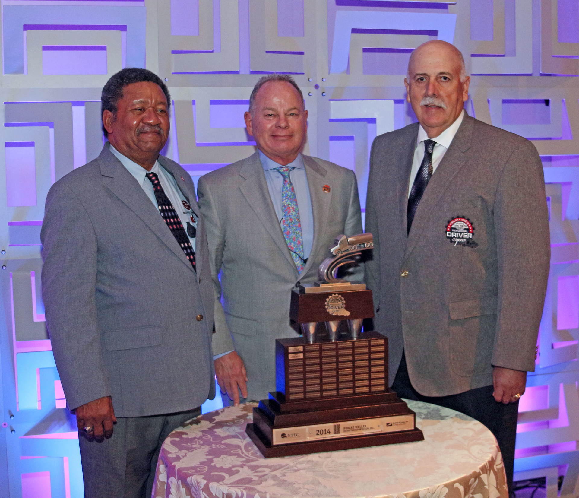 Robert Weller right Hahn Transportation Inc was the 2015 recipient of National Tank Truck Carriersrsquo William A Usher Sr Professional Tank Truck Driver of the Year Standing with him are James Starr left Groendyke Transport Inc 2014 recipient of the award and Dean Kaplan 20142015 NTTC chairman and chief executive officer of KLimited Carrier Ltd
