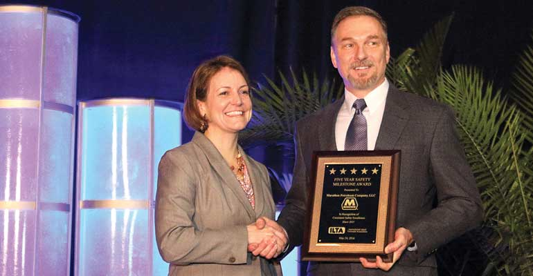 Tim Aydt Marathon Petroleum Company accepts the ILTA Safety Milestone Award from ILTA President Melinda Whitney