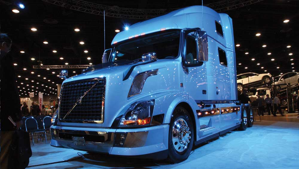 Blue stage lighting gave this Volvo VN a striking appearance during the truck builderrsquos press conference at MATS Powertrain enhancements and advanced aerodynamics such as the sun visor redesign are boosting VN fuel efficiency by 8