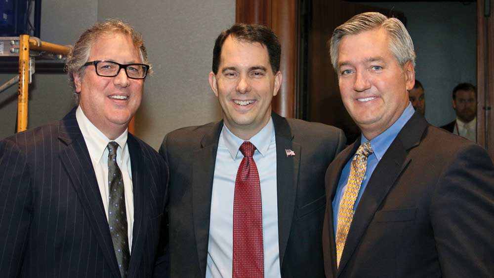Following his keynote speech Wisconsin Governor Scott Walker center was joined by Dan Furth NTTC and Hans Schaupp LCL Bulk Transport Inc