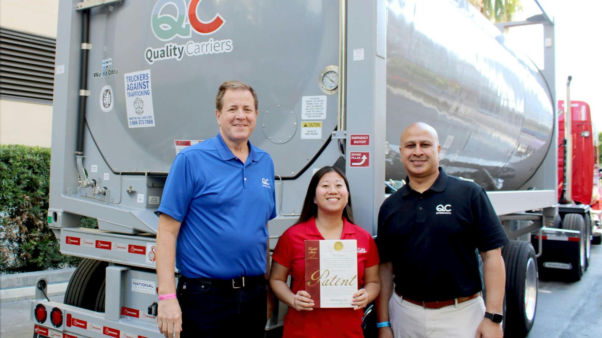 From left to right are Randy Strutz, Quality Carriers president; Anne Laughlin, corporate counsel; and Alok Kumar, vice president of intermodal.
