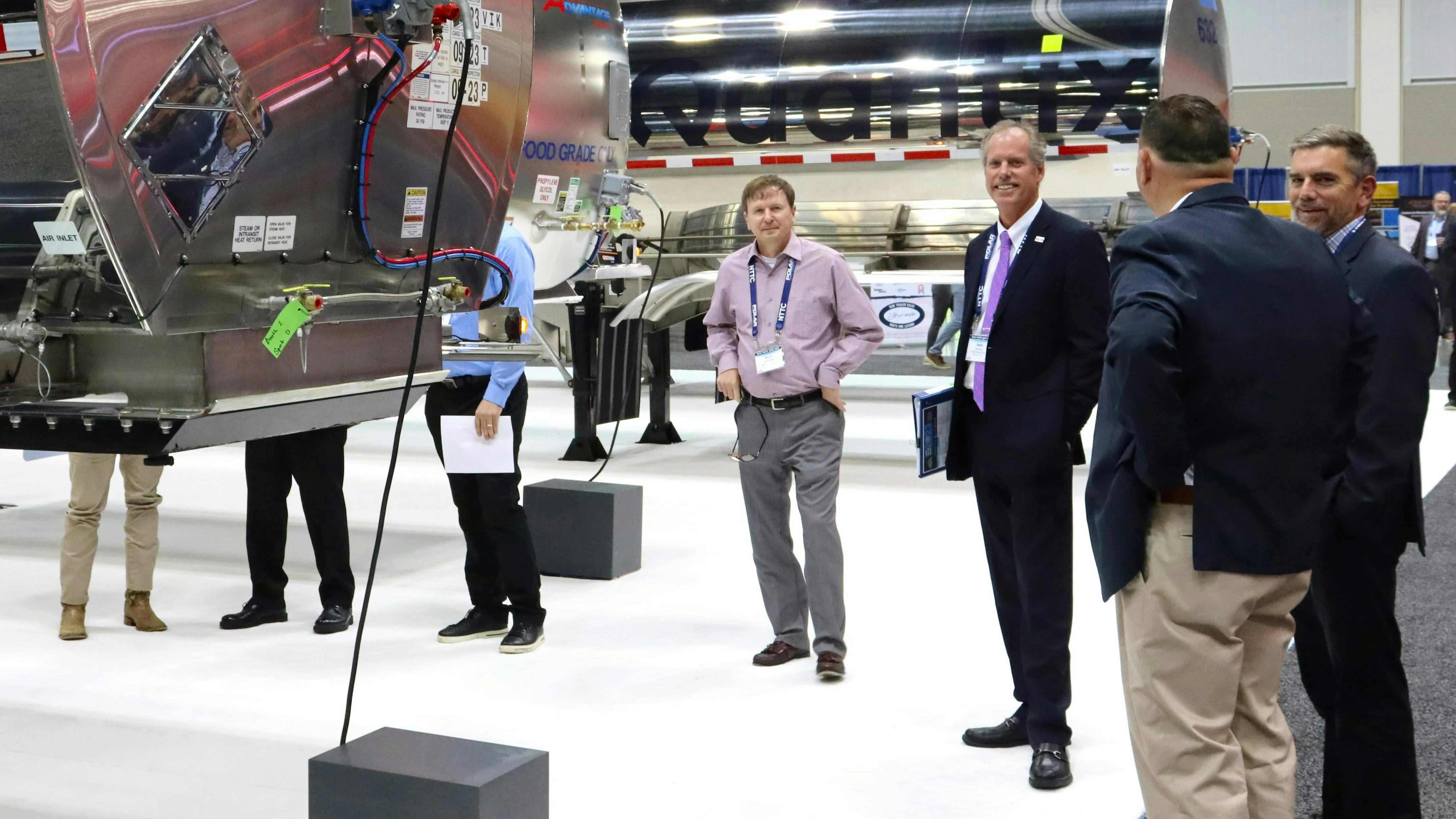 NTTC chairman Herb Evans visits the exhibit hall during Tank Truck Week 2023.