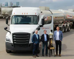 From left to right are Trimac executives Matt Faure, Jeff McCaig, and Ryan Collinge, who are standing with Trimac's 2024 NTTC North American safety championship trophy. From left to right are Trimac executives Matt Faure, Jeff McCaig, and Ryan Collinge, who are standing with Trimac's 2024 NTTC North American safety championship trophy.