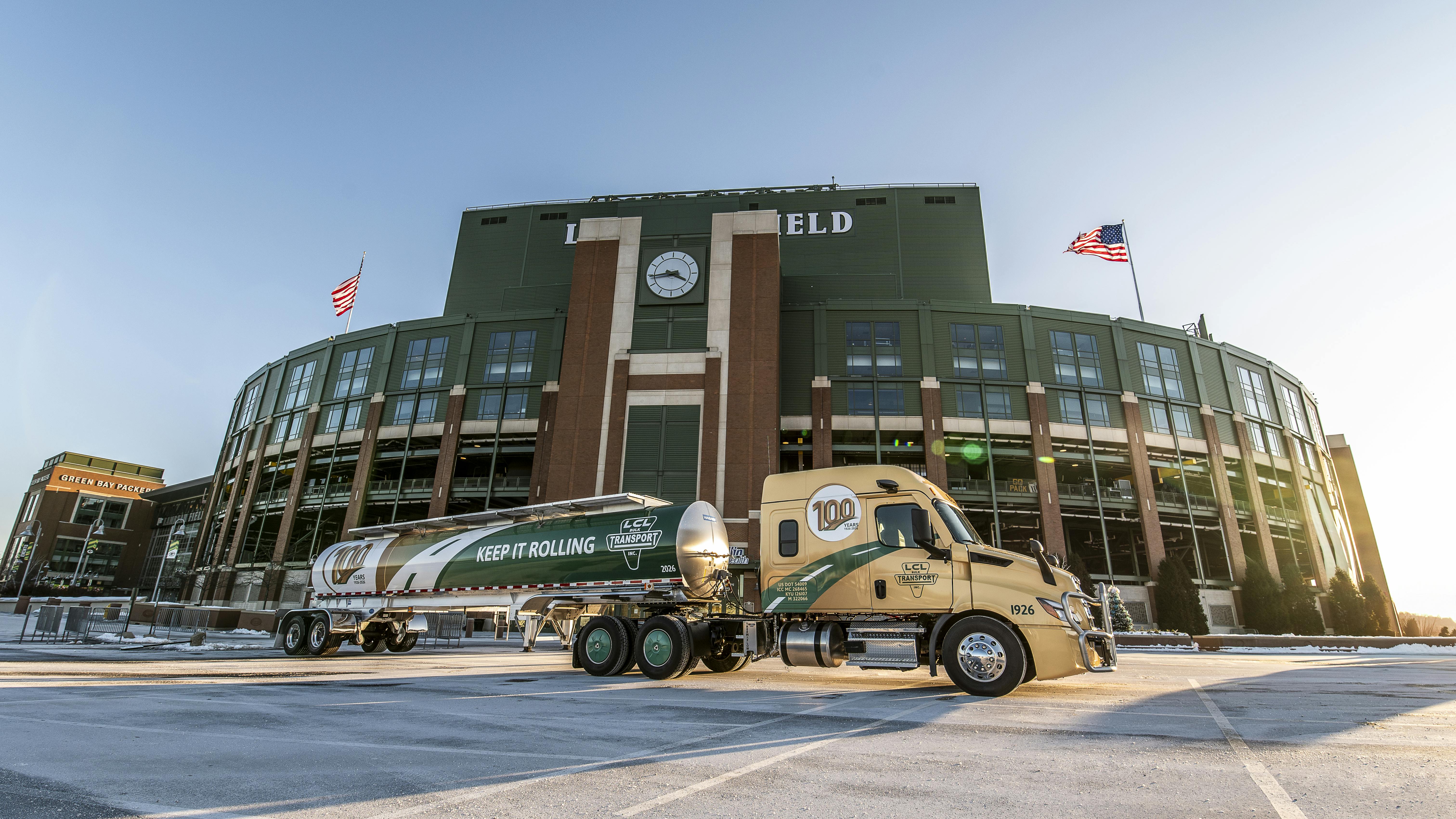 A special anniversary-edition LCL Bulk Transport tank truck sits in the Lambeau Field parking lot before the carrier's 100th-anniversary celebration.