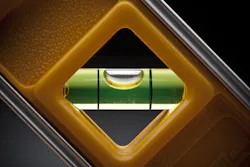 Leveling tool on a dark background Leveling tool on a dark background