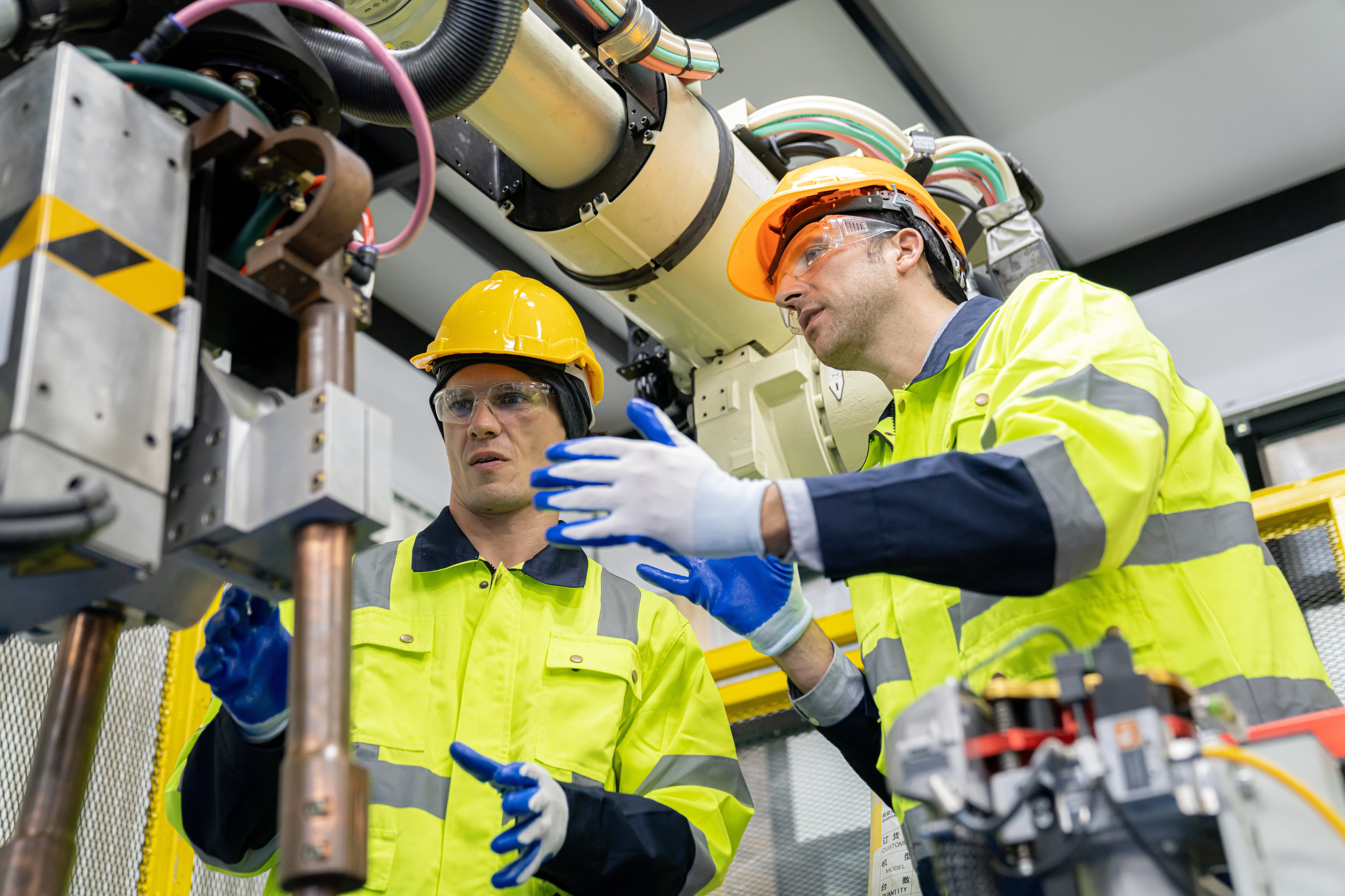 Engineer working wearing personal protection equipment PPE, hard hat and other safety apparel