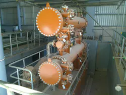 Figure 1. Example of shell and tube heat exchangers with their nozzles during construction. Figure 1. Example of shell and tube heat exchangers with their nozzles during construction.