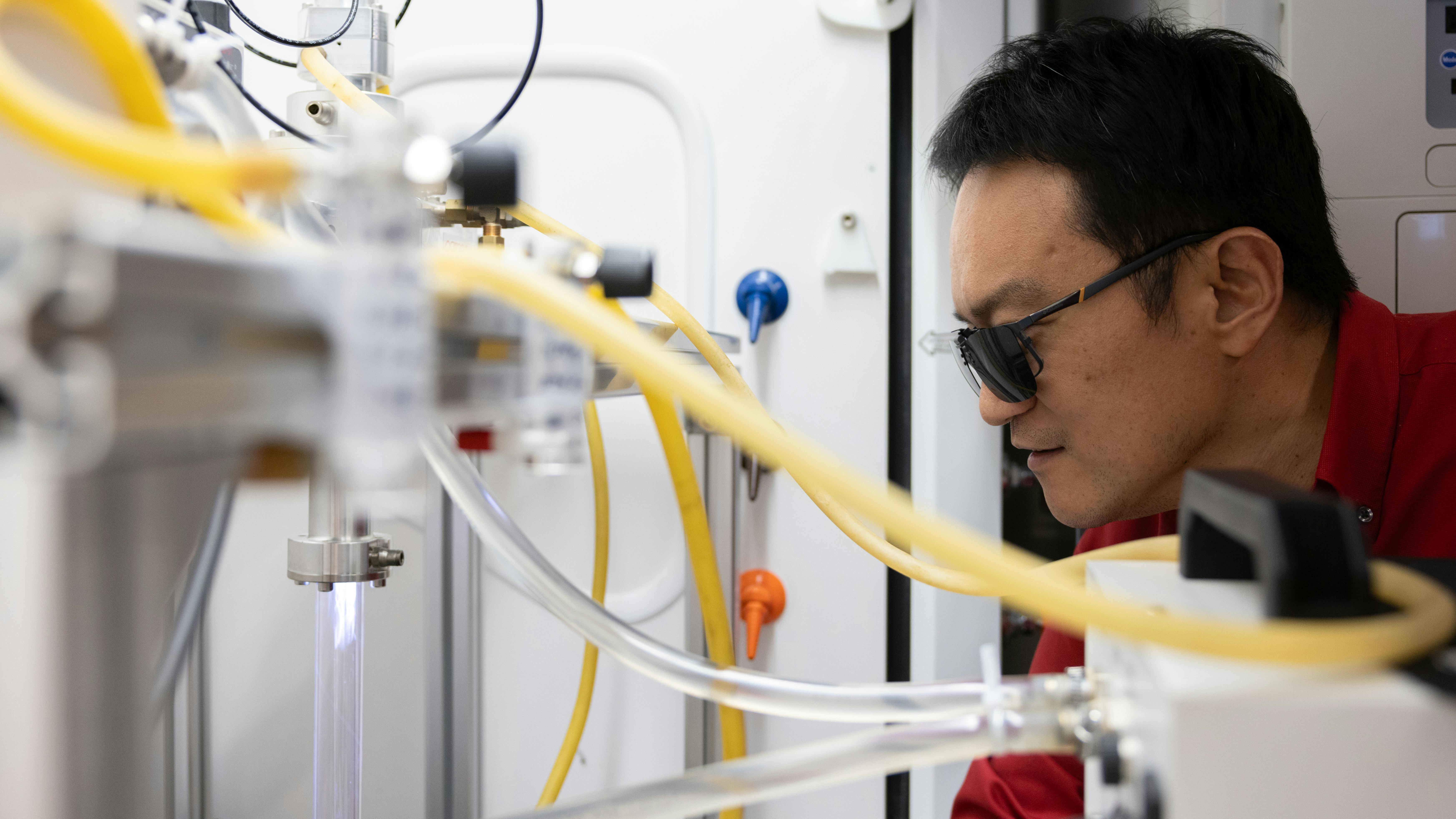 Professor Xiaonan Shan explains microwave plasma in his lab at the University of Houston.