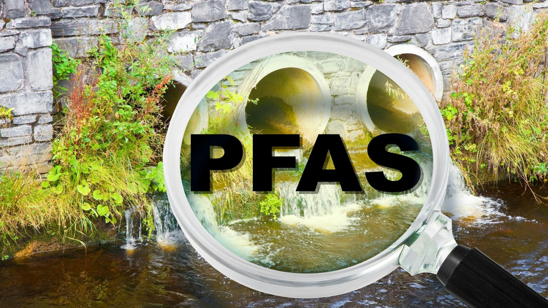 Industrial wastewater with magnifying glass looking for PFAS