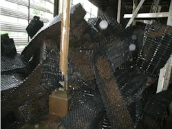 Total fill support collapsed from the weight of microbiological fouling accumulations. Total fill support collapsed from the weight of microbiological fouling accumulations.